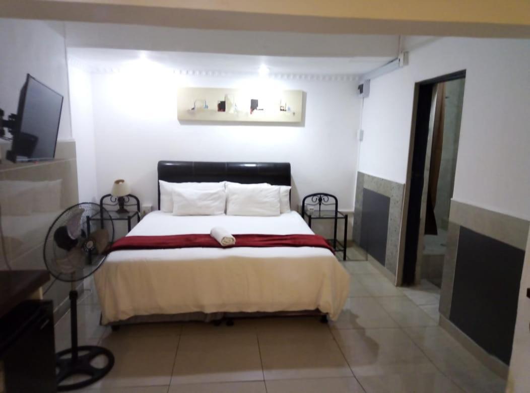 Caribe Accommodation And Conferences Питърмарицбург Стая снимка